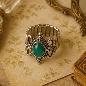 Regal Scrollwork Ring with Green Cat’s Eye Center Stone
